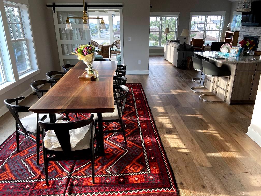 Large walnut live-edge slab dining table built by Four Fields Furniture