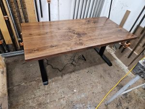 Walnut sit-stand desk top in the shop, custom made in Minneapolisâ€“St. Paul