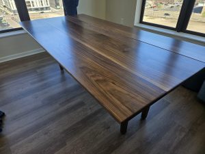 Large walnut dining table top shown from above, custom made in Minneapolis–St. Paul