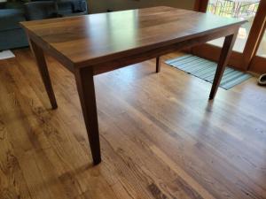 small wood base walnut dining table